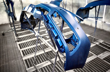 Fototapeta premium Preparation and painting of car parts after an accident.