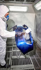 Preparation and painting of car parts after an accident.