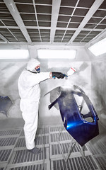 Preparation and painting of car parts after an accident.