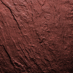 A natural background made of multi-colored wild stone close-up. View from above