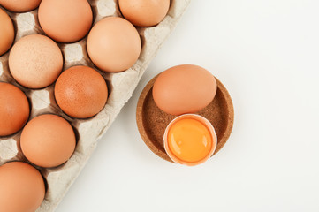Raw chicken eggs on white background, top view
