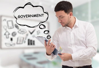 Business, technology, internet and network concept. The young businessman comes to mind the keyword: Government