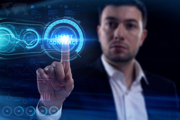 Business, Technology, Internet and network concept. Young businessman working on a virtual screen of the future and sees the inscription: Smart contract