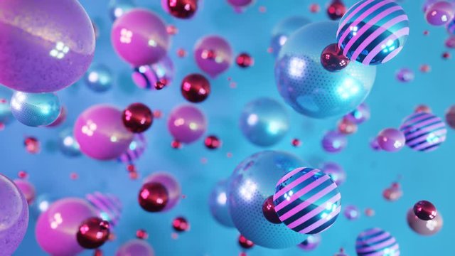 Blue and violet spheres with reflection falling. Abstract 3D realistic background with balls. Modern design. Luxury background. Dynamic Wallpaper with balls or particles. Looped 4K animation.
