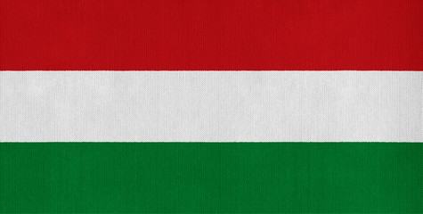 National flag of Hungary on a cotton texture background
