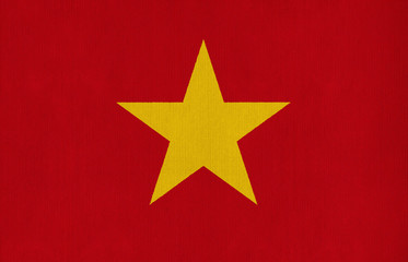 National flag of Vietnam on a cotton texture background