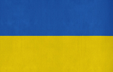 National flag of Ukraine on a cotton texture background