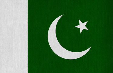 National flag of Pakistan on a cotton texture background