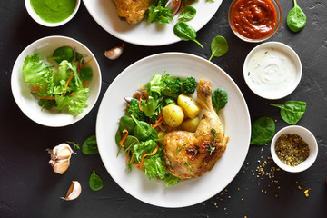 Grilled chicken leg with potato and green salad