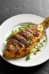 Roasted fish on plate