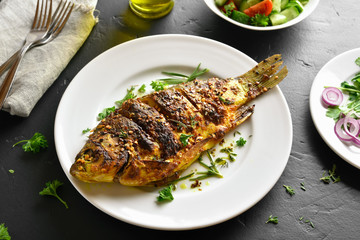 Roasted fish on plate