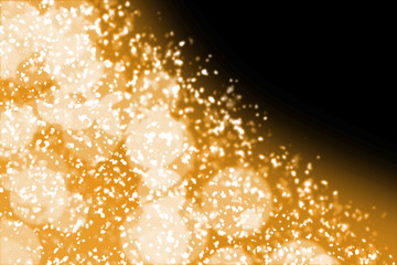 Fairy abstract magic elegant gold bokeh on black background