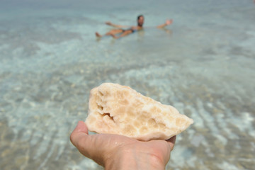 View of Dead Sea coastline. Salt crystals at sunset. Texture of Dead sea. Salty sea shore