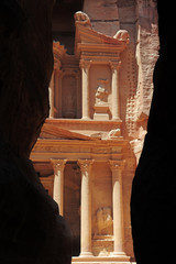 Al Khazneh in the ancient city of Petra, Jordan during the day. It is known as The Treasury. Petra has led to its designation as a UNESCO World Heritage Site. Seven wonder of world
