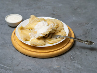 Dumplings with cottage cheese and sour cream.