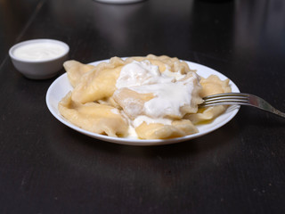 Dumplings with cottage cheese and sour cream.