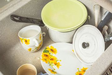 Dirty dishes in sink after eating.