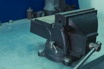 Vise on workbench. Equipment locksmith workshop. equipment for a