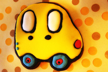 Gingerbread cookie. Yellow car with large windows. Background