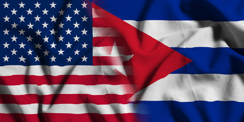National flag of the United States with Cuba on a waving cotton texture background © Onur