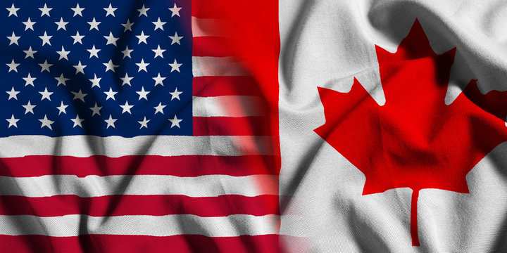 National flag of the United States with Canada on a waving cotton texture background