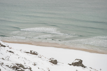 Winter beach covered with snow