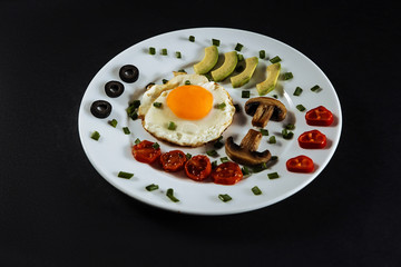 fried egg with tomatoes, fried egg with mushrooms, fried avocado egg