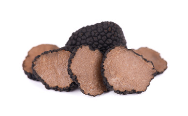 Black truffles isolated on a white background. Fresh sliced truffle. Delicacy exclusive truffle mushroom. Piquant and fragrant French delicacy. Clipping path.