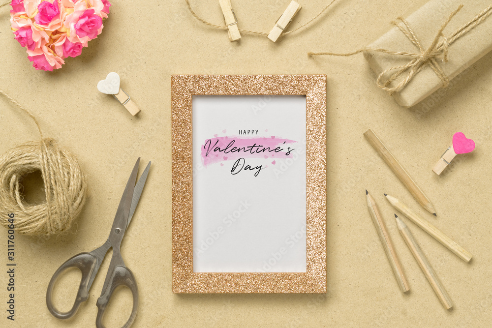 Poster mockup photo frame with kraft present boxes and craft rose flower for valentines day concept. top vi