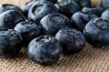 Freshly picked blueberries in burlap background.Concept for healthy eating and nutrition