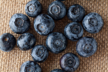 Freshly picked blueberries in burlap background.Concept for healthy eating and nutrition