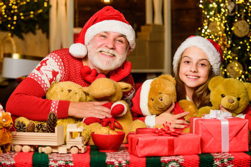 Fototapeta na wymiar Happy childhood. Gift surprise. Gift teddy bear toy for kid. Boxing day. Family values. Lovely gift. Child enjoy christmas with grandfather Santa claus. Festive tradition. Happiness and joy