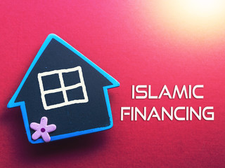 ISLAMIC FINANCING written on red background with wooden house