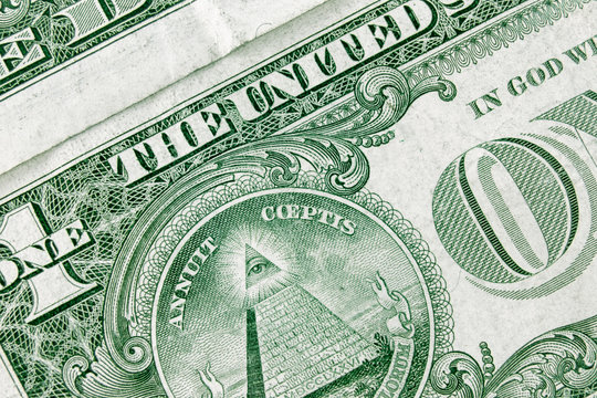 Dollar bill background with focus to masons logo on it. Freemasons and secret society concept.