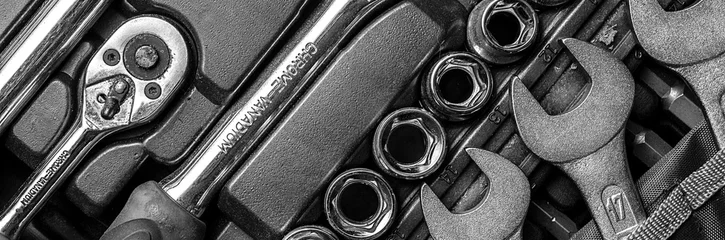Black and white men tools background. Worker tools and  equipments close-up. Panoramic banner. © ruslan_khismatov