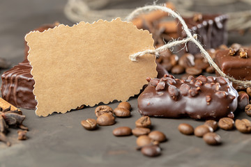 Appetizing food background. Sweets and coffee beans around the card for notes. 