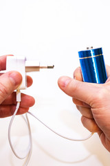 Batteries in the hands of a man on a white background, isolated.