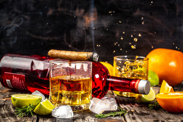 concept of alcoholism, loneliness, dependence. A bottle of whiskey, a glass of whiskey and with...