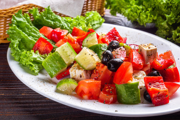 greek salad on dark wooden rustic background