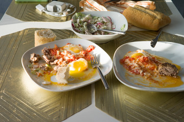 Unfinished breakfast with bfried eggs