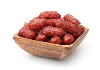 Wooden bowl of mini smoked sausages