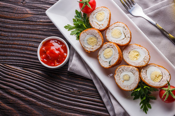 Scotch egg meat balls on rustic wooden background