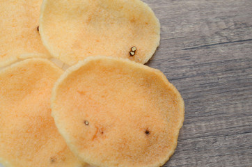 shrimp chips isolated on wooden table