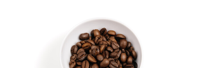 Coffee beans in a white cup. Isolated. White background.
