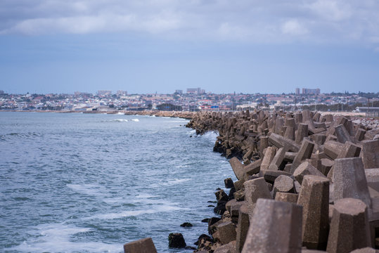 Dolos Stacked Along Coastline