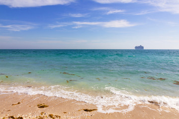 Blue sea water, sand tropical beach. Abu Dhabi, Sir Bani Yas island, United Arab Emirates.