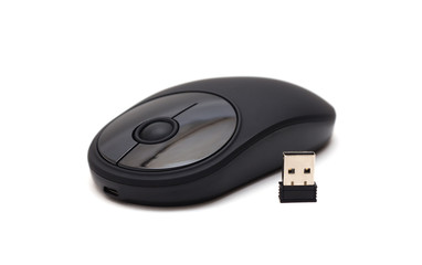 Black wireless mouse with adapter isolated on white background