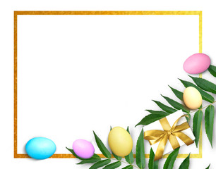 Naklejka na ściany i meble Easter golden frame with colorful eggs, palm leaves and gift box composition on white background. Mock up greeting holiday flatlay.