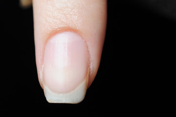 Close up photo of woman doing manicure with nail file