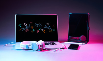 Laptip and touch pad with social media icons.